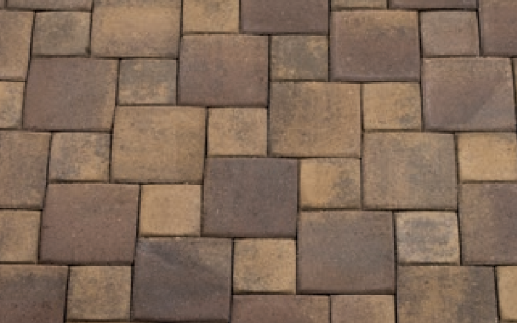 Close-up view of a hopscotch paver pattern featuring standard pavers in territorial earth tones.