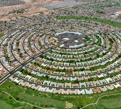Aerial view of the unique circular street layout and concentric housing rings of Sun City, Arizona.